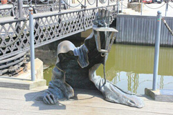 Statue of the Black Ghost that guards a Lithuanian city. Image, Atlas Obscura