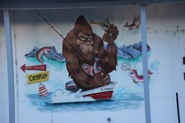 Image, Bigfoot fishing and drinking beer