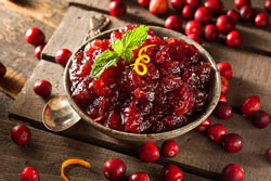 Bowl of cranberry sauce with orange zest.